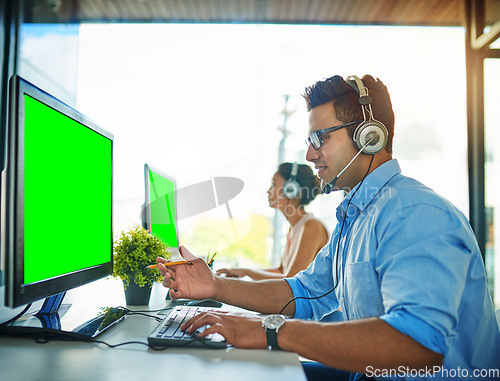 Image of Businessman, call center and consulting on green screen computer in customer service or telemarketing at office. Man person or consultant agent talking on mockup PC or chromakey display in contact us