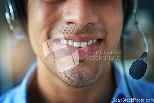 Image of Happy man, teeth and smile in call center with headphones for customer service or telemarketing. Closeup of friendly male person or consultant agent mouth smiling with headset mic in contact us
