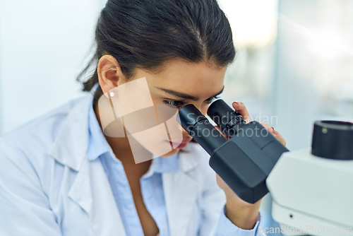 Image of Research, woman and scientist with microscope in lab for medical study. Healthcare, science and female doctor with scope equipment for sample analysis, particle testing and laboratory experiment.