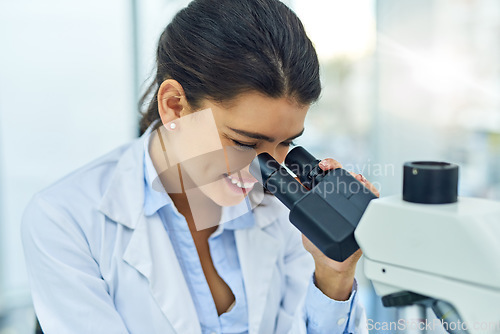 Image of Research, woman and scientist smile with microscope in laboratory for medical study. Investigation, science and female doctor with DNA sample for future analysis, particle test or lab experiment.