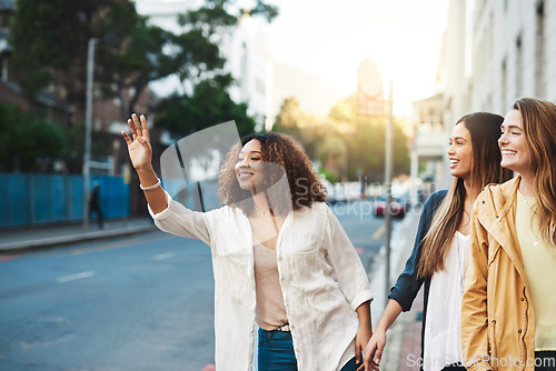 Image of Friends, women stop taxi in street with travel in city and together outdoor, freedom and happiness. Young female people in cityscape, urban adventure and wait for cab, smile while on friendship date