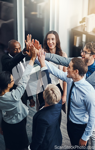 Image of Motivation, high five and success with business people in office for support, winner and teamwork. Collaboration, diversity and community with group of employees for solidarity, target and goals