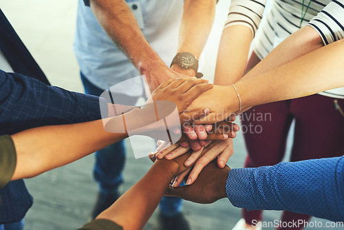 Image of Team trust, hands together and motivation of staff with collaboration, support and community. Diversity, worker friends and group with achievement, solidarity and agreement hand sign for teamwork