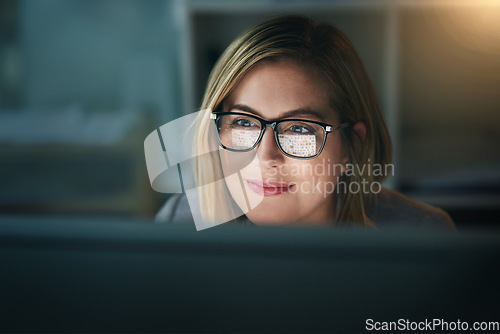 Image of Businesswoman, glasses and working late on a computer or or overtime for a project deadline or schedule and in an office. Research, email and face of corporate worker or analysis and online at night