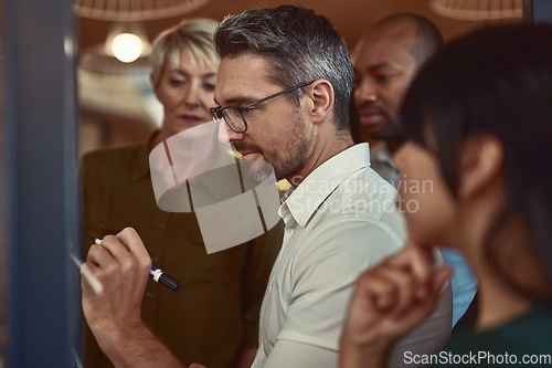 Image of Businessman, coach and writing in schedule planning for team brainstorming, collaboration or strategy at office. Man employee in leadership, coaching or training staff in teamwork for project plan