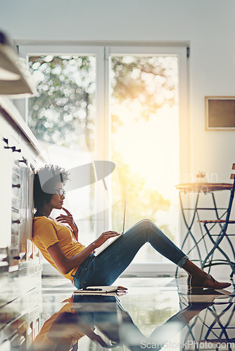 Image of Relax, laptop and search with black woman on floor for focus, remote work and study. Technology, website and networking with female freelancer thinking at home for blog, email and social media