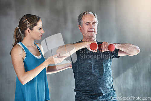 Image of Physical therapy, dumbbell and coaching with old man and personal trainer for support, health and physiotherapy. Training, weightlifting and fitness with senior patient and physiotherapist for help