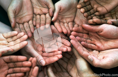 Image of Open hands, diversity and palm with helping community, hunger and support. Poor, poverty and charity help with people and trust with crowd and society union donation and giving question from above