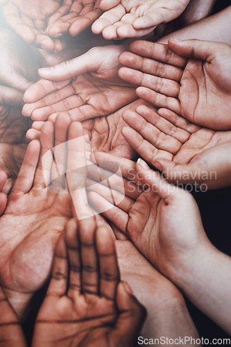 Image of Open hands, diversity and group together with community, solidarity and support. Hunger, faith and charity hands gesture with people and poverty with crowd show palm and society and charity donation