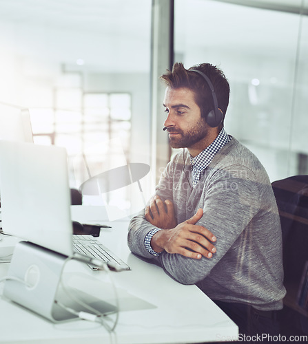 Image of Call center, arms crossed and business man in office for customer service. Telemarketing, serious and male person, sales agent or consultant working for support, consulting and contact us online.