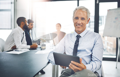 Image of Meeting, portrait of senior ceo businessman with tablet and in modern office with his team. Workshop, technology and corporate male person or leader and in a boardroom brainstorming or planning.