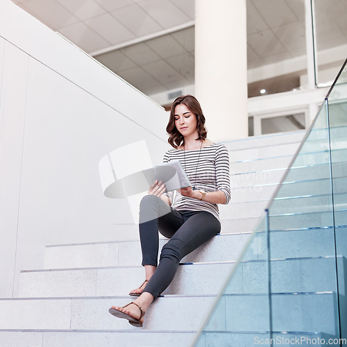 Image of Tablet, research and woman on the staircase in the office planning a corporate project. Technology, career and professional female employee working on company report with digital mobile in workplace.