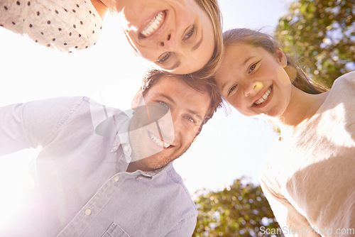 Image of Nature portrait, blue sky and happy family love of child, mother and father bonding in park, forest or outdoor woods. Freedom, happiness or below view of mama, papa and kid smile for natural sunshine