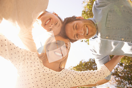 Image of Face portrait, sky and happy family hug, love and solidarity circle of child, mom and dad bonding in nature park. Care, fresh air and below view of people smile for natural sunshine, freedom or peace