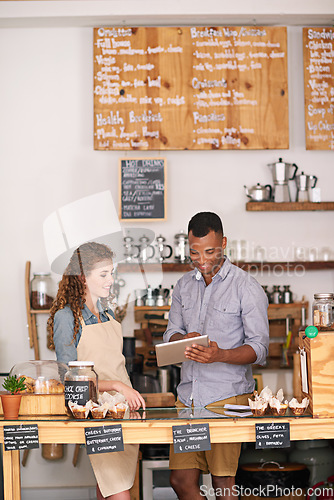 Image of Coffee shop owners, tablet and teamwork of people, manage orders and discussion in store. Waiters, black man and happy woman in cafe with technology for inventory, stock check and managing sales.