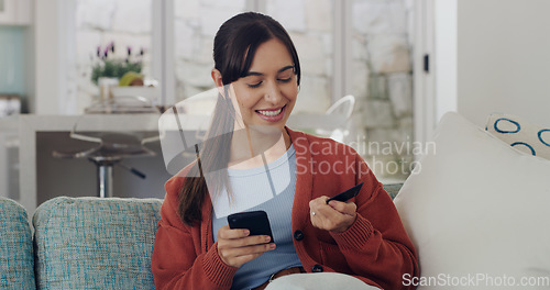 Image of Happy woman, credit card and online shopping on smartphone in home for digital payment, fintech or money transfer. Female, mobile banking and finance of cash, web sales and password for financial app