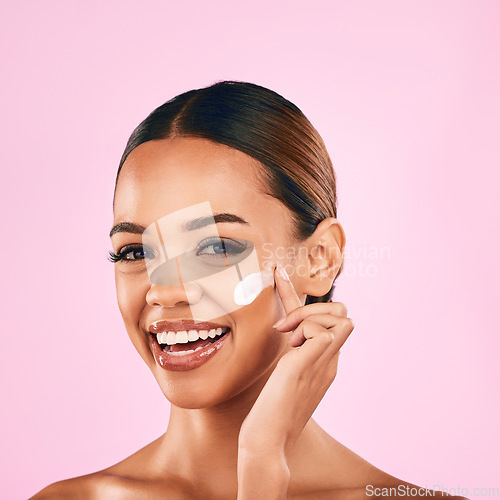 Image of Happy woman, portrait smile and skincare cream for beauty moisturizer against a pink studio background. Female person or model smiling in happiness for lotion, cosmetic products or facial treatment