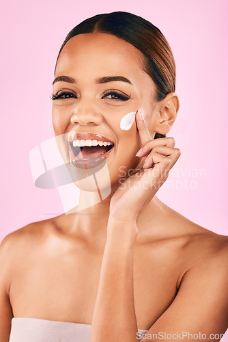 Image of Happy woman, portrait and skincare cream for beauty moisturizer or cosmetics against a pink studio background. Female person or model with smile for lotion, cosmetic products or facial treatment