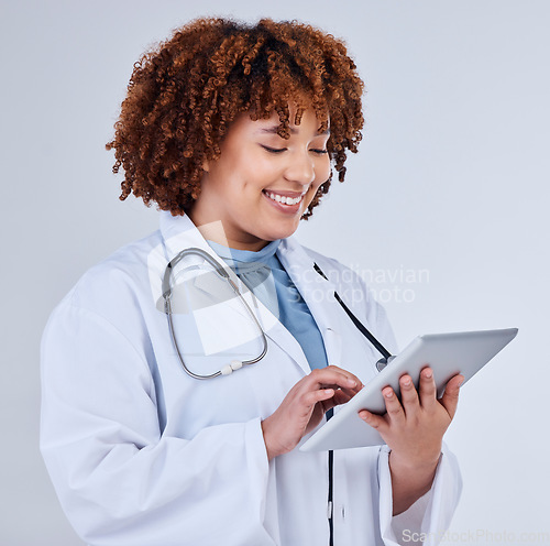 Image of Tablet, doctor or african woman isolated on a white background for healthcare research, clinic or telehealth services. Nurse or medical person typing on digital tech, paperless or software in studio