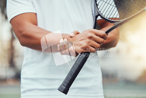 Image of Tennis court, hand injury and man with racket for sports, fitness and match with discomfort or bruise. Joint pain, wrist and male player with arthritis, osteoporosis or fibromyalgia during training