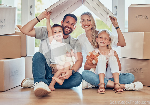 Image of Portrait of happy family, new home and cardboard roof for insurance, safety and future investment in real estate. Moving, boxes and happiness, mom and dad with kids in house with property mortgage.