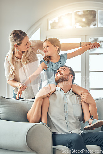 Image of Mom, dad and child on sofa with flying game, piggy back and playful fun in living room for happy family. Mother, father and kid playing airplane games on couch with smile, happiness and love in home.