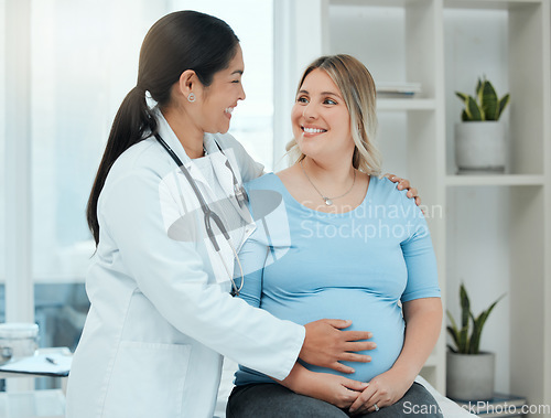 Image of Healthcare, comfort and doctor with a pregnant woman in a clinic touching her belly for support. Maternity, wellness and female nurse hugging a patient with pregnancy during a prenatal consultation.