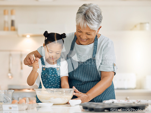 Image of Bake, grandmother and girl with ingredients, learning and development with utensils, food or love. Family, granny or female grandchild in a kitchen, dough or teaching skills with happiness or bonding