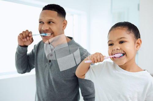 Image of Family, girl and father brushing teeth, home and oral hygiene with happiness, learning and development. Love, dad or daughter in a bathroom, dental care or female child with fresh breath and wellness