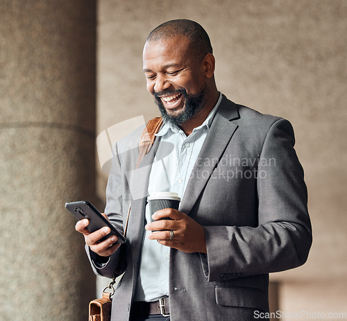 Image of Phone, coffee and businessman in the city walking to corporate office while networking. Happy, town and African male employee browsing on social media, mobile app or internet while commuting to work.