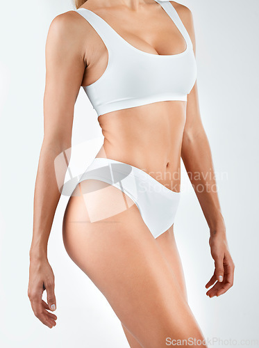 Image of Body, diet and woman in lingerie in studio for wellness, health and lose weight on white background. Underwear, detox and female model with cosmetic, treatment and glowing, skin and slimming results