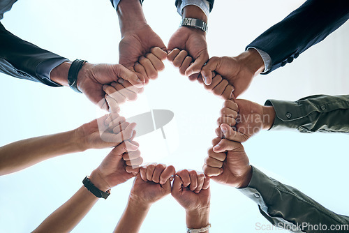 Image of Fist, hands and business group outdoor with collaboration, teamwork and success sign. Below, team and solidarity of employee people with goal, target and workforce circle for support and motivation