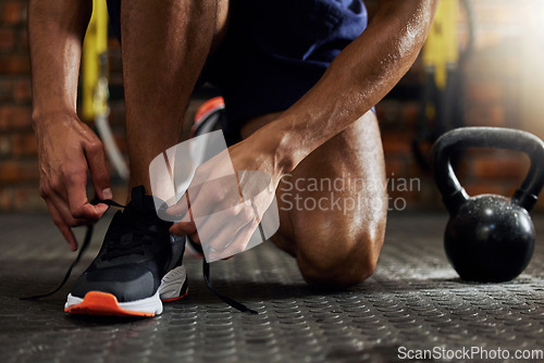 Image of Tie shoes, man hands and gym for fitness, strength training and exercise. Athlete feet, sport routine and male person prepare to start workout and wellness class at a health center with sneakers