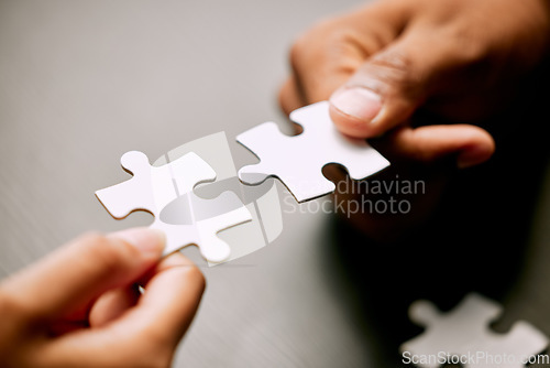 Image of Puzzle, hands and people or partner for solution, teamwork and goals, achievement or workflow success. Team building, games and development of person or team problem solving, synergy or collaboration