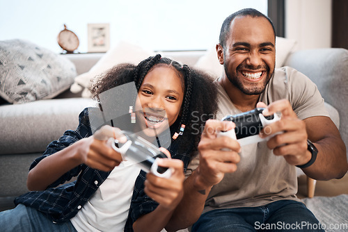 Image of Gaming, family or children with a father and daughter in the living room of their home playing a video game together. Kids, happy or fun with a gamer dad and girl child in the house to play online