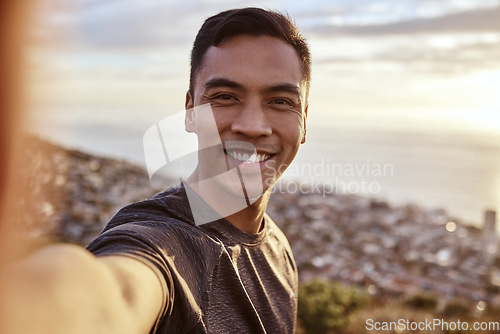 Image of Fitness, selfie and portrait of a man on a mountain running for race, marathon or competition training. Sports, workout and happy male runner athlete taking a picture doing an outdoor cardio exercise