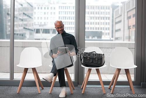 Image of Business man, tablet and chair in waiting room, queue and opportunity of job interview, recruitment process or human resources. Black male, digital technology and browsing internet in line for hiring