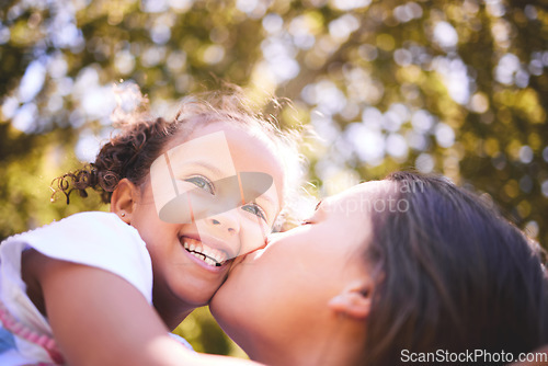 Image of Mother, child and kiss in nature, smile or bonding on summer holiday vacation. Mom, kissing cheek and happy girl, love and affection, care and enjoying quality family time together outdoor in park.