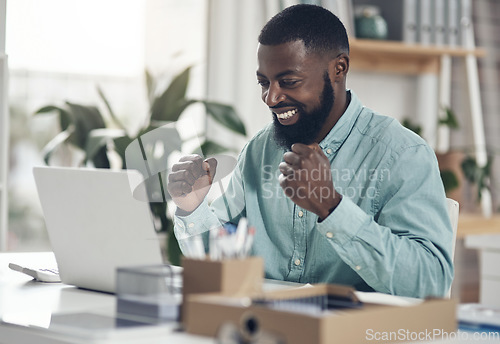 Image of Success, black man and laptop to celebrate business profit, win or achievement in an office. African male entrepreneur at a desk with motivation, fist and technology for bonus, victory or promotion