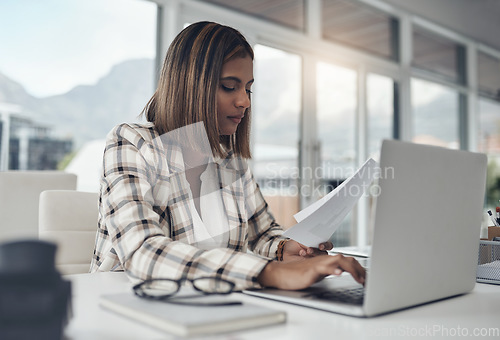 Image of Business analyst, laptop and woman typing paperwork in office workplace. Documents analysis, computer and female person reading, working and analyzing data, graphs or charts for finance statistics.