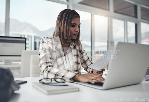 Image of Laptop, data documents and woman typing in office workplace for business. Paperwork analysis, computer and female person reading info for analyzing analytics, graphs or charts for finance statistics.