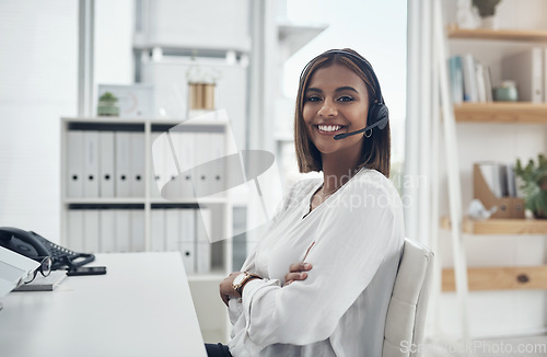 Image of Telemarketing, business and woman with arms crossed, portrait and customer service in a modern office. Face, female person or employee with a smile, headphones and professional with a career and help