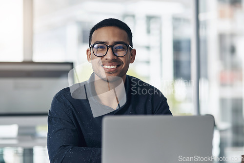 Image of Portrait, laptop and a professional journalist man at work in an editing agency for news reporting. Computer, smile and online content with a happy male editor working in a modern journalism office