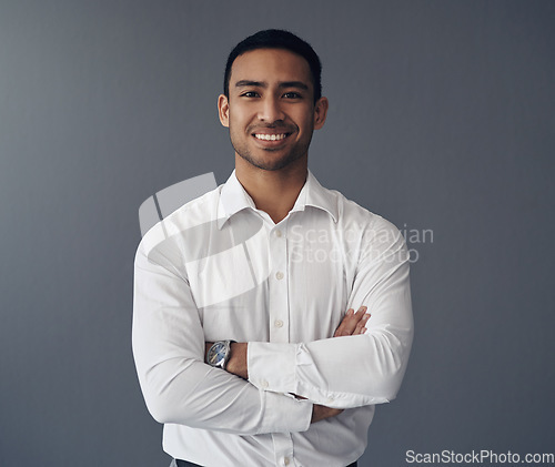Image of Portrait, business and Asian man with arms crossed, career and confident guy against a studio background. Face, male person and employee with happiness, startup success and professional with a smile