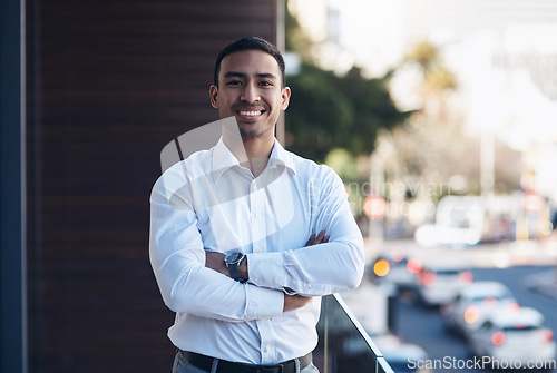 Image of Portrait, business and man with arms crossed, smile and confident guy with happiness, startup success and office balcony. Face, male person and employee with a career, entrepreneur and professional