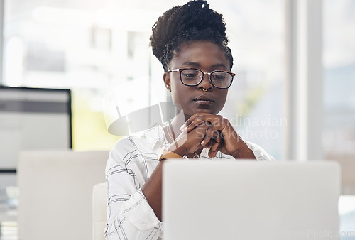 Image of Thinking, focus and african woman on laptop for solution, research and serious job decision or planning. Reading, review and choice of person or business analyst on computer for data problem solving