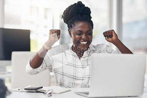 Image of Black woman, success and laptop to celebrate business profit, win or achievement in office. African female entrepreneur at a desk with motivation, fist and technology for bonus, victory and promotion