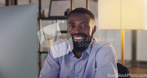 Image of Business man, portrait and computer at night while working at a desk for report or deadline. Happy black male entrepreneur with technology for marketing, internet connection or productivity in office