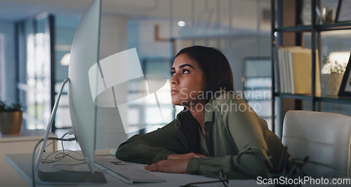 Image of Business woman, bored and computer work at night while reading online data and info at desk. Tired, burnout and young female employee feeling fatigue from web deadline and internet research project