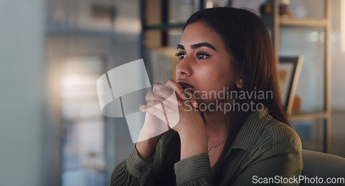 Image of Business woman, thinking and computer at night in office with anxiety, stress or crisis. Female entrepreneur at desk with tech while tired or worried about deadline, mistake or mental health problem
